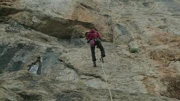 A Fearless Adventurer Conquering the Majestic Peak with Determination and Grit video