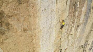 The Great Ascent. Conquering the Majestic Cliff Face with Determination and Courage video