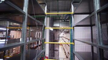 View inside of the inside of a large industrial facility. Creative. Stairs and shelves in a storage room. video