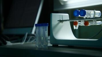 Preparation of medicine. Stock footage. Pharmaceutical production and testing of medicines with rotating test tubes with different liquids. video