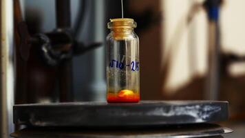 Laboratory test tube with rotating particle and liquid. Stock footage. Rotating liquid in test tube in chemical laboratory. Chemical compound in small test tube video