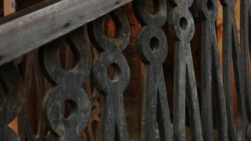 Vintage wooden railing on porch of house. Stock footage. Old wooden railings with patterns. Architectural wooden architecture with patterns on wood video