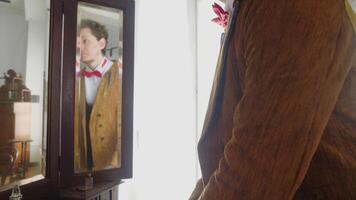 The man is a magician. Stock footage. A young actor in a brown suit with a hat who is assigned to the performance. video