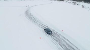Slow motion of racing cars sliding on an ice track. Clip. Concept of winter drift and extreme sport. video