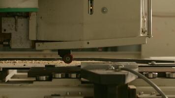 Work in a factory. Creative. A working machine for working and sawing out of wood. video