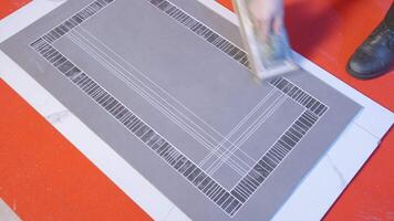 Worker cleans lines on tile. Creative. Cleaning of seams in tile joint. Carpenter smoothes lines on tile with spatula video