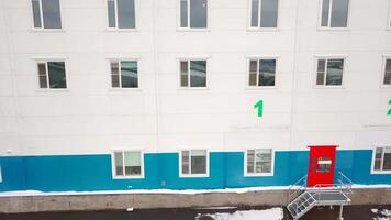Warehouse facade with entrances for unloading. Creative. Top view of warehouse entrances for unloading trucks. Entrances with numbers for unloading deliveries video