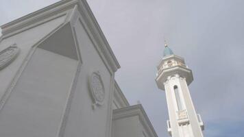 Exterior of a white mosque, concept of religion and architecture. Scene. Beautiful building with big windows. video