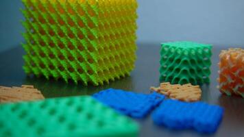 Close-up of abstract cubes from constructor. Stock footage. Abstract toy constructor with geometric shapes. Constructor with cubes and abstract details video