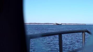 Window in fishing boat with view of river and shore. Clip. View from window of fishing boat on sunny winter day. Window with view of river and shore from boat video