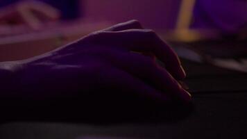 Close-up of man playing computer games. Stock footage. Hand moves mouse and presses keyboard during computer game. Gamer moves mouse and presses keyboard video