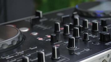 Man in sound studio working with sound mixer console. Media. DJ hands and sound machine, music production. video