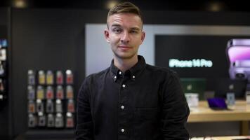 Portrait of young man with raised eyebrow. Action. Expression of young man's face with raised eyebrow. Young man with facial expression in workplace video