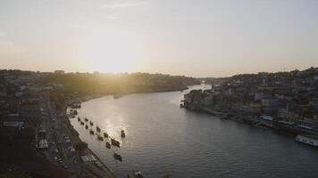 Top view of beautiful old town with ships in river. Action. Beautiful river landscape with ships and ancient city. Big old town by river with line of ships in summer video