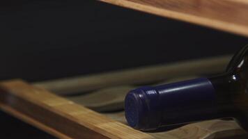 Wine cellar. Animation. Closely removed shelves with expensive wine that lie on special shelves indoors. video
