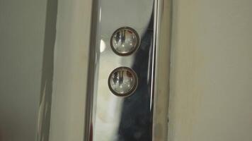 Close-up of man pressing elevator button. HDR. Reflection of man in elevator button. Business men with tension call service lift by pressing button video