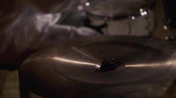A man at a party playing musical instruments. Clip. A young creative man playing percussion instruments in the night. video
