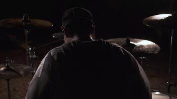 Close-up of drummer hitting drums. Clip. Active playing with sticks on drums. Musician beats rhythms on old drum kit video