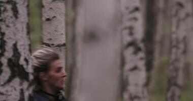 Lost man running through the woods trying to find a way out. Orientation, fear and survival, activity in nature concept. video