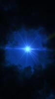 Dramatic dark bright fluffy clouds flying around lonely shining star. Animation. Abstract beautiful sky of dark blue color, bottom view of abstract nature at night. video