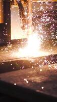 Welding patterns on metal in factory. Clip. Automated machine for welding seams in factory. Factory machine for creating patterns on metal by welding video