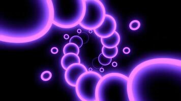 Glowing 3d spiral of balls. Design. Neon circles move in spiral stream on black background. Beautiful 3d spiral with neon circles video