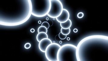 Glowing 3d spiral of balls. Design. Neon circles move in spiral stream on black background. Beautiful 3d spiral with neon circles video