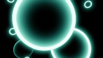 Neon 3d balls move in spiral in space. Design. Glowing rings with the shape of 3d ball on black background. Glowing balls move in dizzying spiral flow in space video