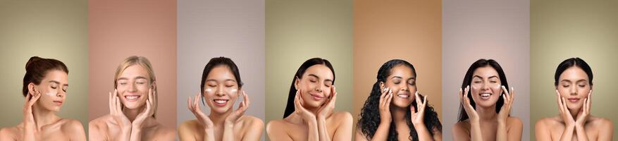 Seven women with different skin tones and hair colors are smiling as they apply a creamy product to their faces in front of seven solid color backgrounds. Each woman has her hands on her cheeks photo
