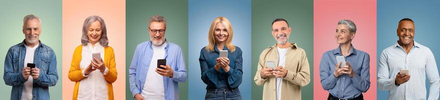 A diverse group of older adults stands together, happily interacting with their smartphones photo