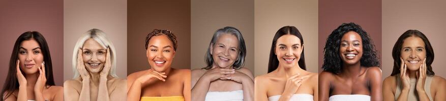 A group of diverse women, each with different hair color, age, and skin tones, stand in a row smiling at the camera and touching their faces. All women are wearing white tops and have a natural look. photo