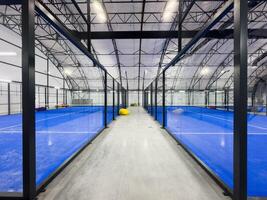 Padel court with lines and net indoor photo
