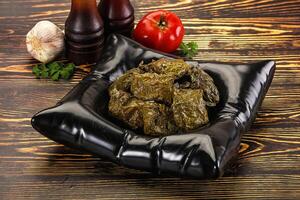 Stuffed dolma - meat in grape leaves photo