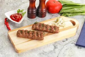 Kebab with beef served onion photo