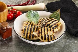 Grilled squid in the plate photo