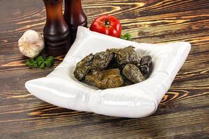 Stuffed dolma - meat in grape leaves photo