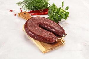 Delicious dry cured beef basturma on table, closeup photo