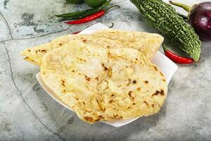 Indian tandori bread - naan with cheese photo