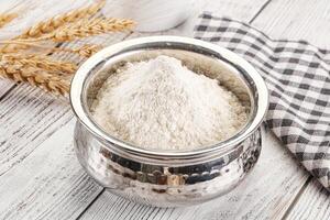 Wheat flour heap for bake photo