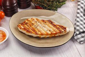 Grilled turkey fillet steak with sauce photo