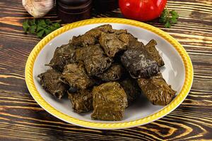 Stuffed dolma - meat in grape leaves photo