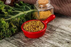 Mustard sauce with seeds in the bowl photo