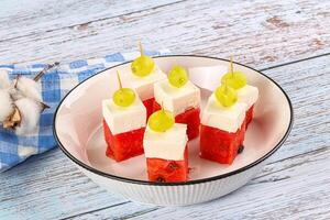 Watermelon with feta and grape photo