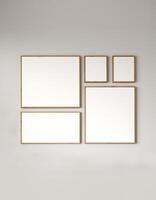 Modern gallery wall with a collection of empty picture frames on a muted background, 3d rendering photo