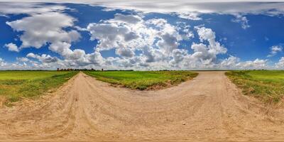 blue sky hdri 360 panorama with awesome clouds on gravel road among fields in spring day in equirectangular full seamless spherical projection, for VR AR content or skydome replacement photo