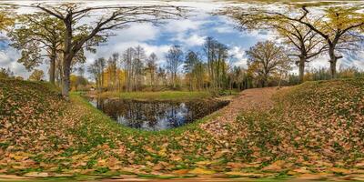 seamless spherical 360 hdri panorama in middle of oak forest near an abandoned pond or lake in golden autumn in equirectangular projection, ready VR AR virtual reality content photo