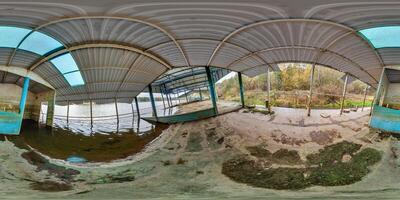 360 hdri panorama on deck of sunken abandoned landing stage ship debarkader on bank of wide river in equirectangular full seamless spherical projection, VR content photo