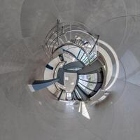 abstractly twisted into spherical 360 panorama interior of modern office with hall staircase and panoramic windows photo