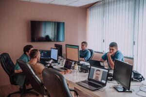 Programmers engrossed in deep collaboration, diligently working together to solve complex problems and develop innovative mobile applications with seamless functionality. photo