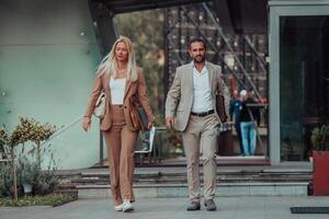 Modern business couple after a long day's work, walking together towards the comfort of their home, embodying the perfect blend of professional success and personal contentment. photo